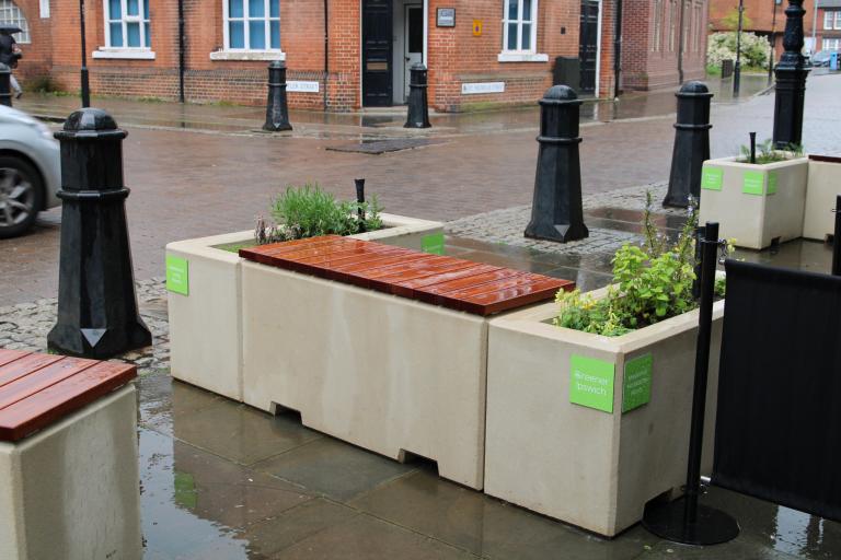 Photo of decorative planters near the Wolsey statue on St Nicholas Street, Ipswich.