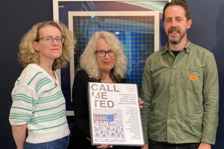 Group of three people with a portfolio of prints donated to Ipswich Museums