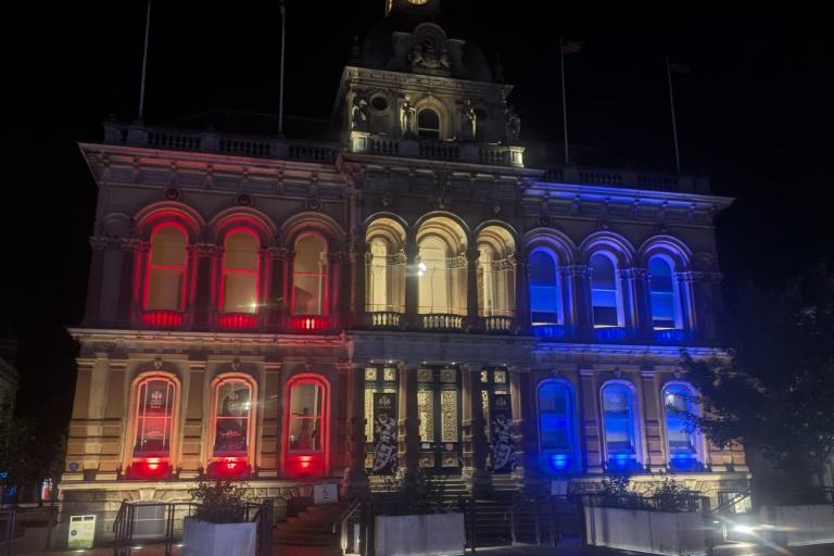 Town Hall Cornhill Ipswich lit up red, white and blue lights in memory of those who died on September 11 in America