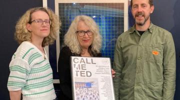 Group of three people with a portfolio of prints donated to Ipswich Museums