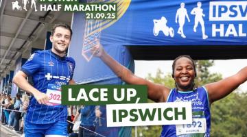 Male and female runners at finish line of Ipswich Half Marathon event