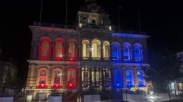 Town Hall Cornhill Ipswich lit up red, white and blue lights in memory of those who died on September 11 in America